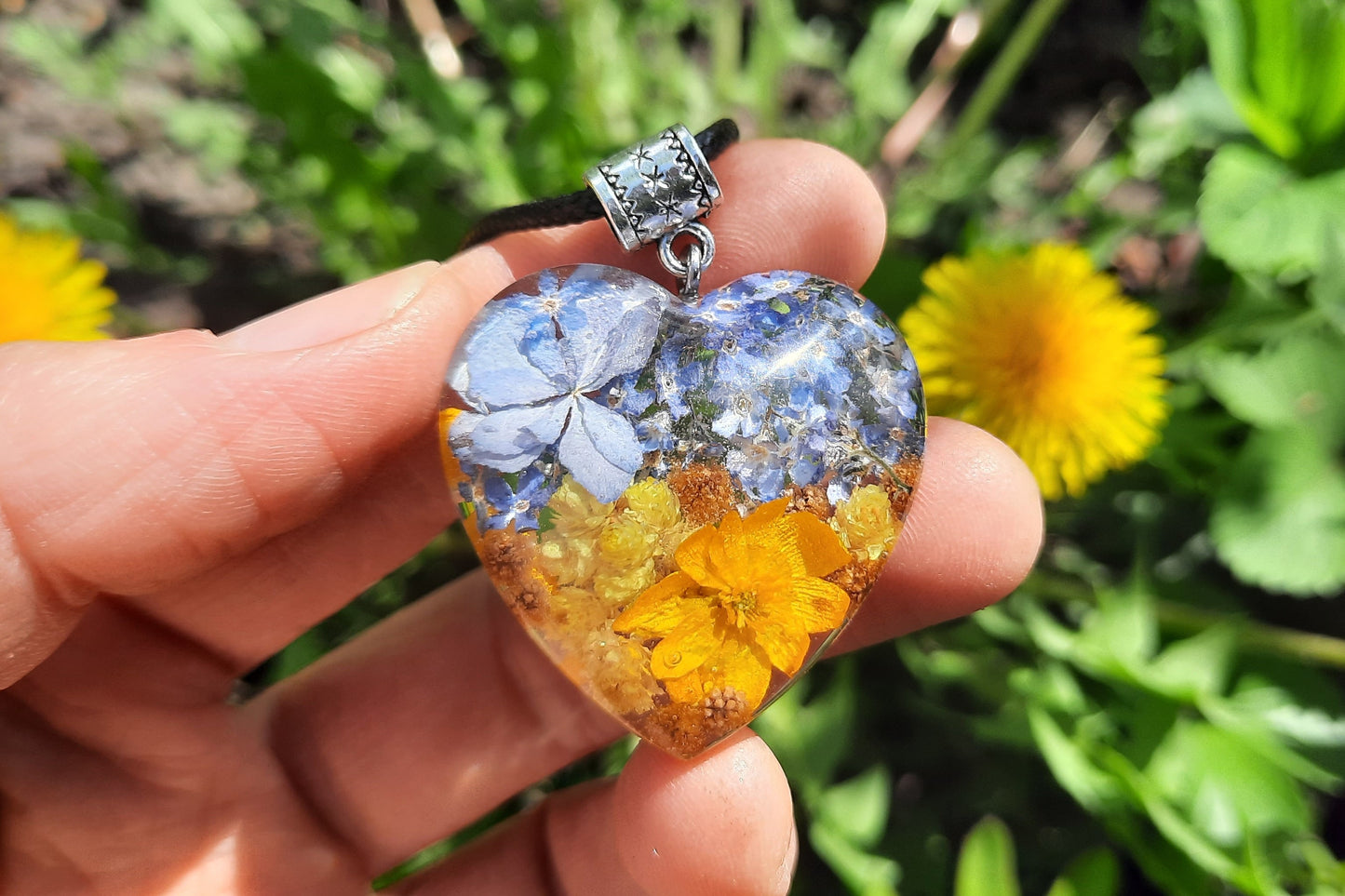 Ukrainian patriotic pendant with flowers in jewelry resin