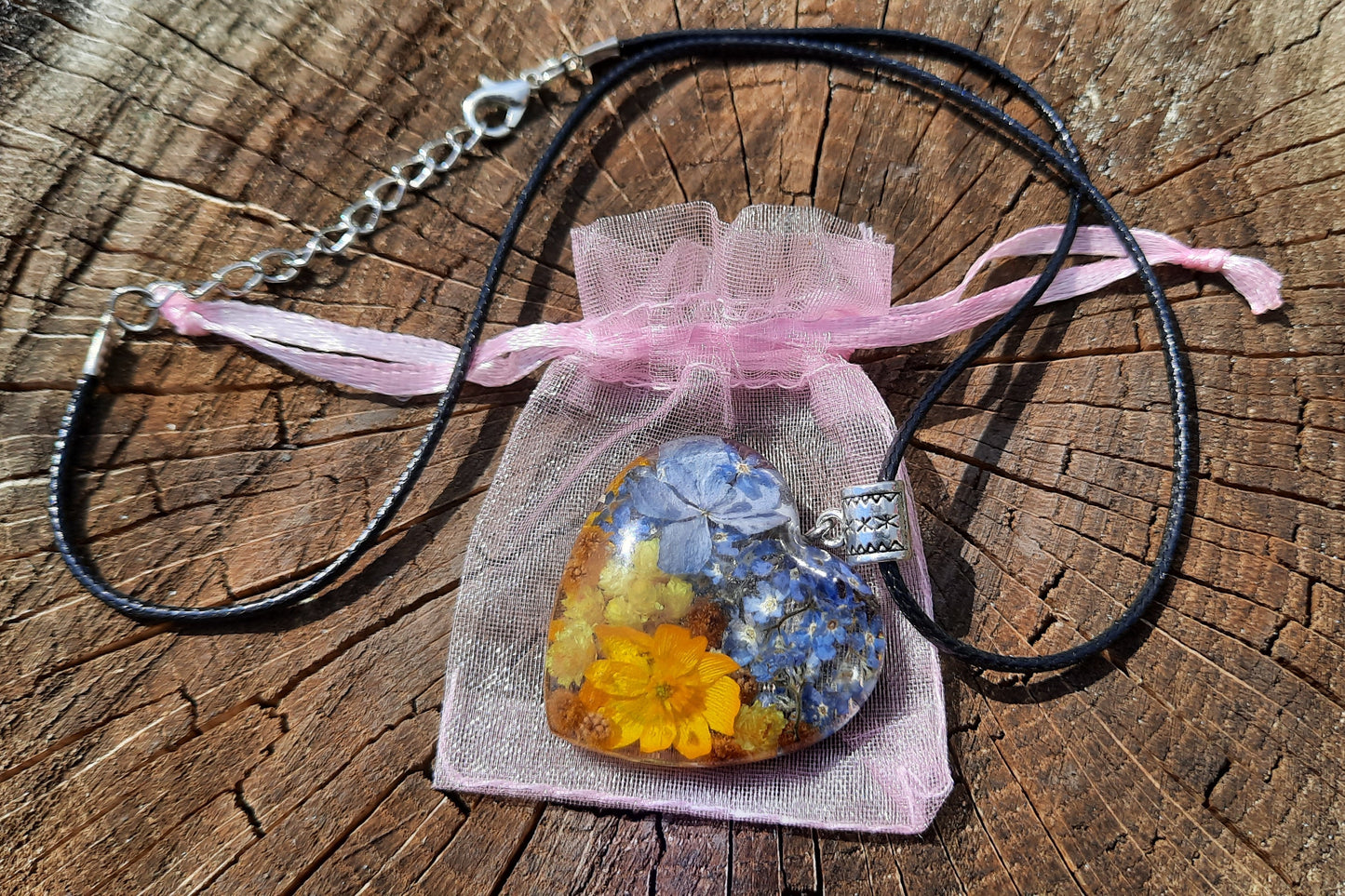 Ukrainian patriotic pendant with flowers in jewelry resin