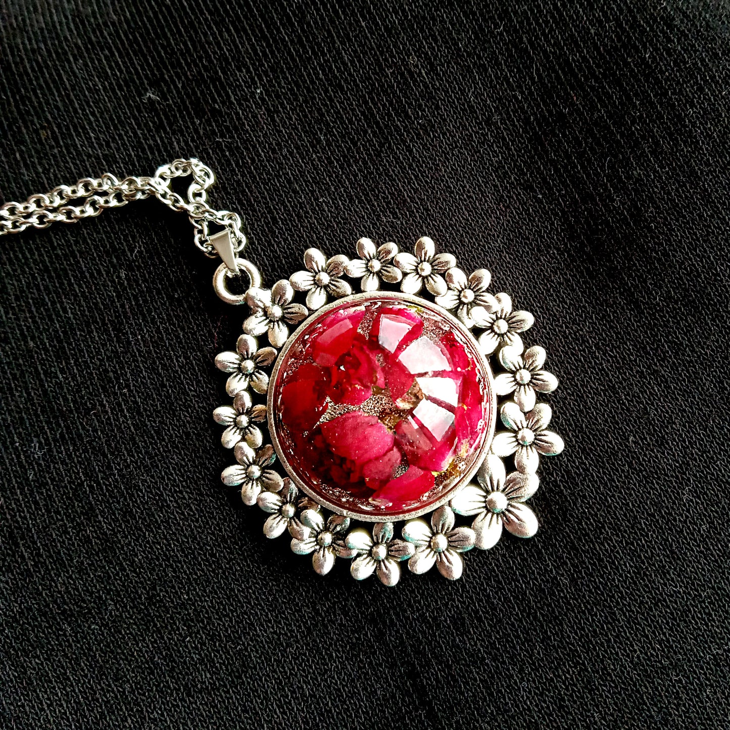 Red roses in resin jewelry pendant