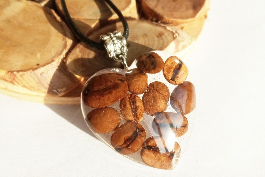 Pendant with coffee beans in epoxy resin.