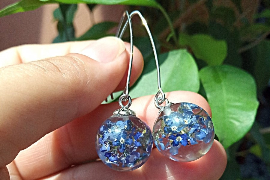 Earrings with forget-me-nots in jewelry resin